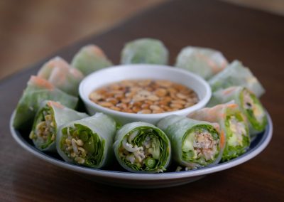 freshly wrapped vegetable spring rolls with dipping sauce